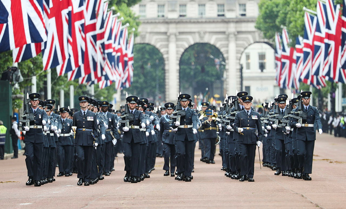 Aviators with Union Jack flags in parade down to The Mall.
